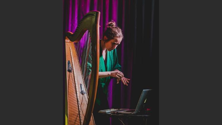 A person playing a harp